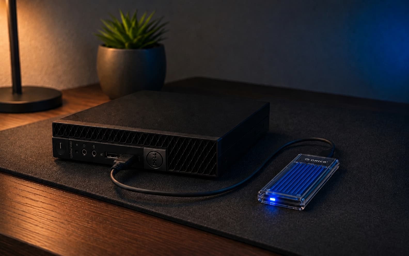 Editorial cover showing Mark's Dell OptiPlex 3040 Micro connected to a transparent NVMe enclosure