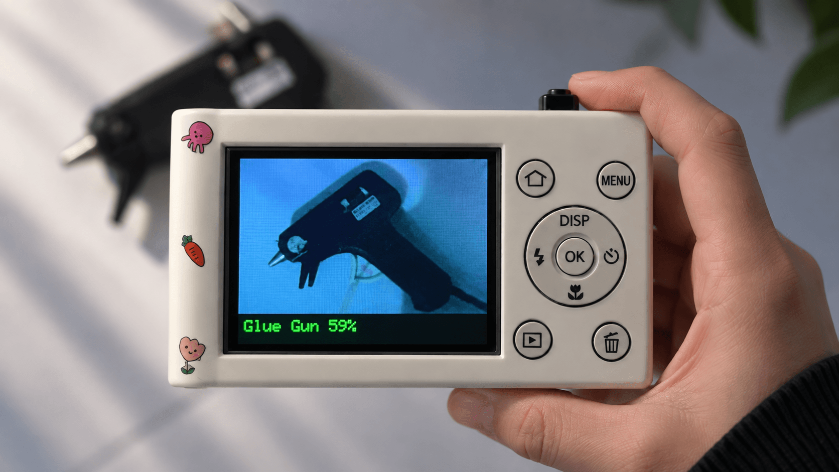 Conan AI Cam displaying glue gun