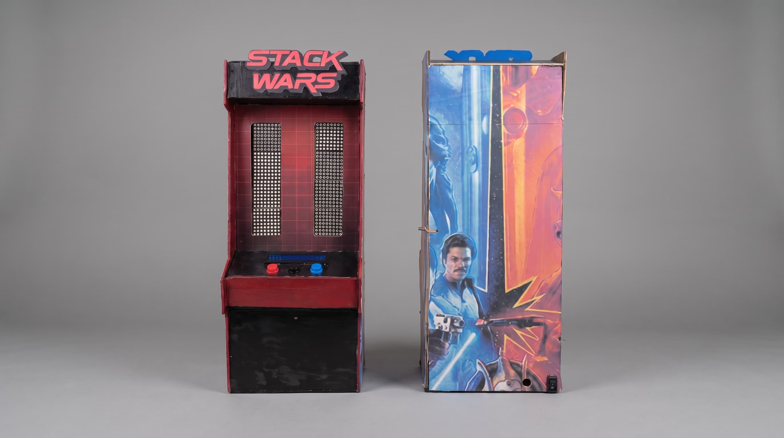 Front and back of the Stackwars cabinet, showing dual LED matrices, an LCD, player buttons, and the rear panel